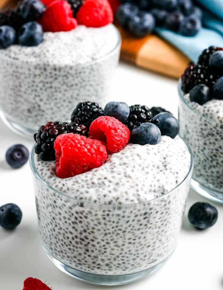 Glass bowl of Chia Pudding topped with berries