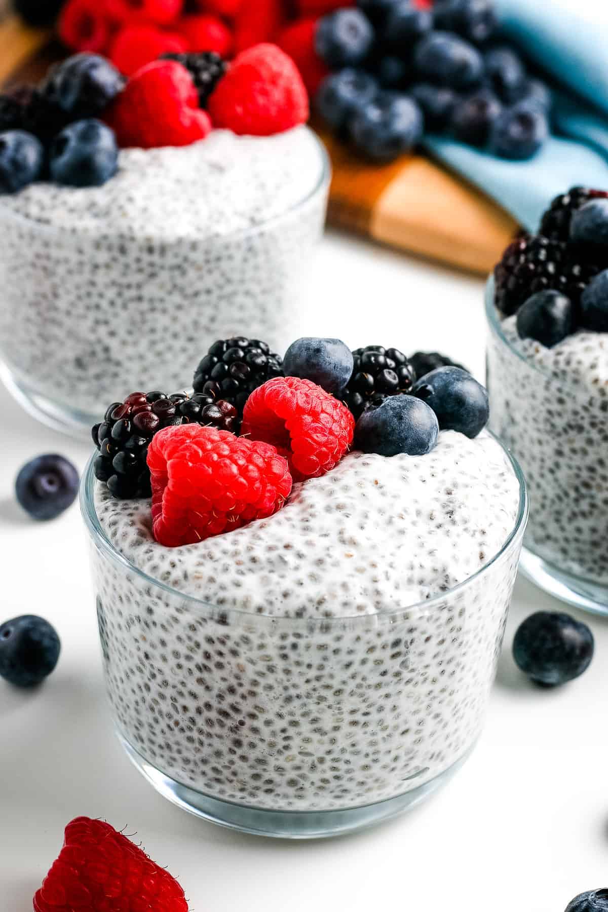Glass bowl of Chia Pudding topped with berries