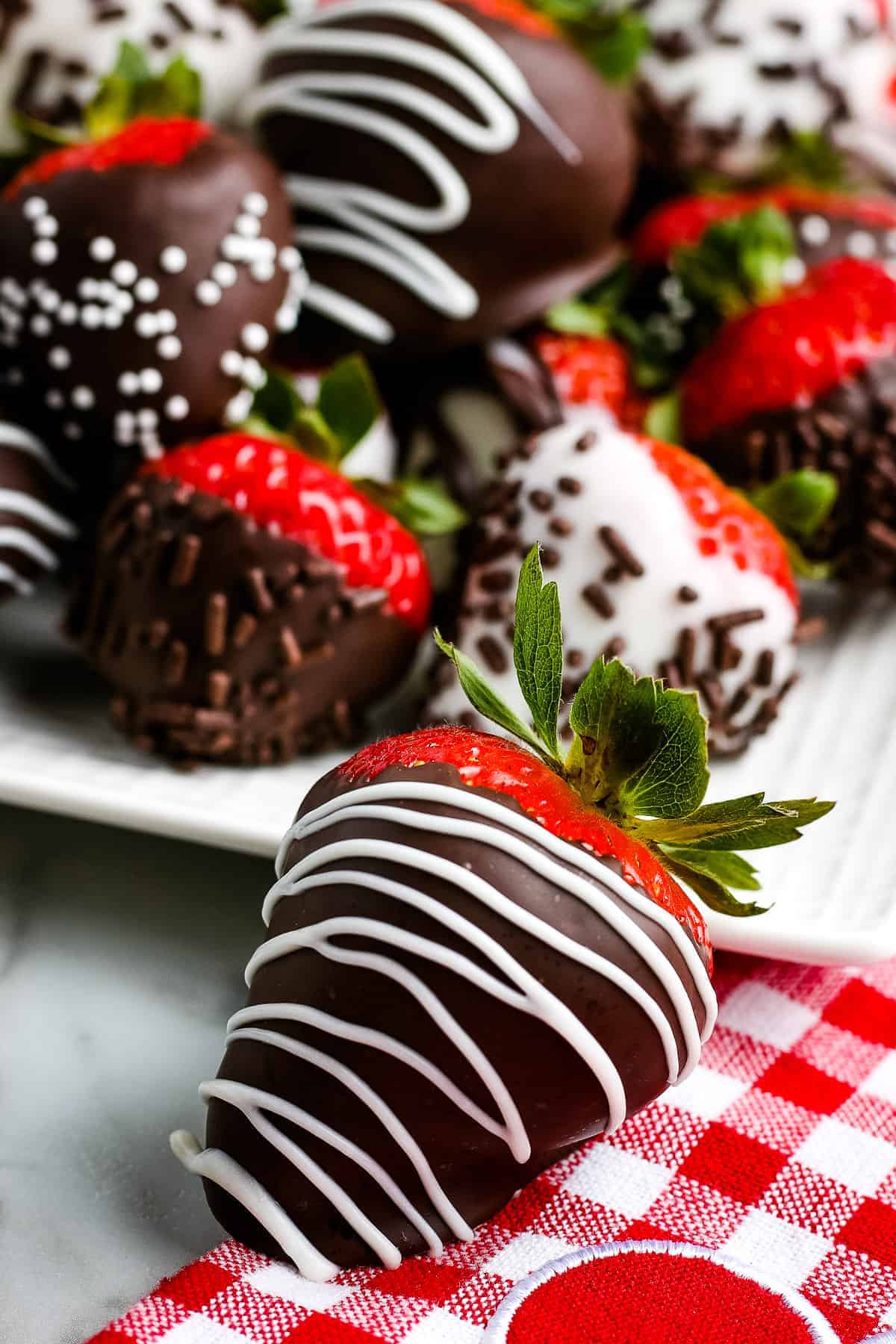 Chocolate Covered Strawberry on red and white checkered napkin