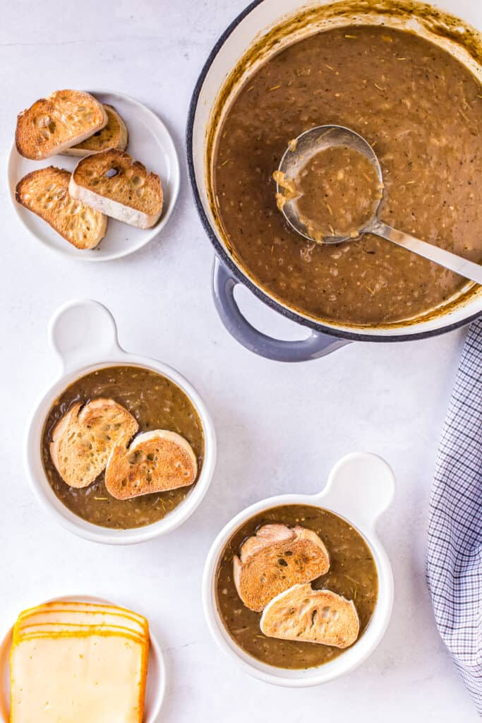 Overhead image of baguettes in French Onion Soup