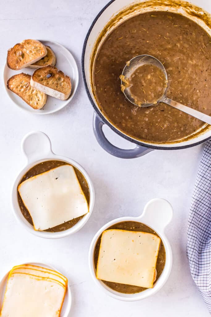 Overhead image of French Onion Soup with cheese before melting