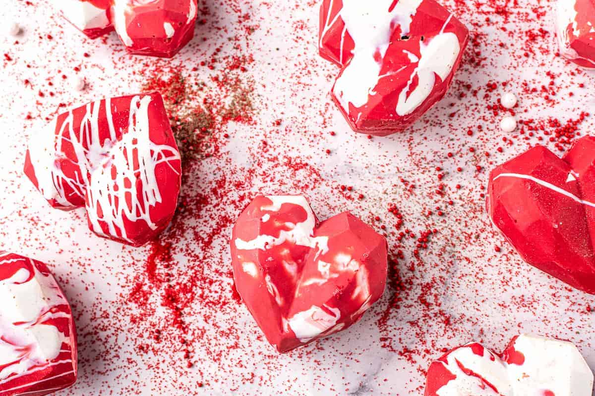 Overhead image of red heart shaped hot chocolate bombs