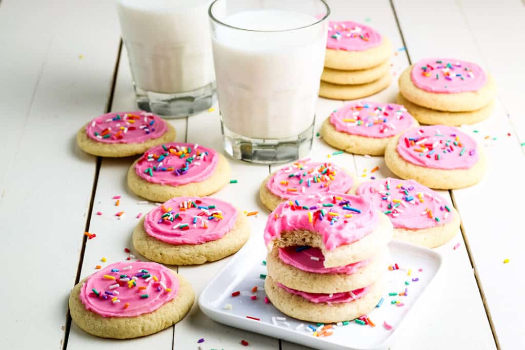 Pink Frosted Lofthouse Cookies in a stack with pink frosting