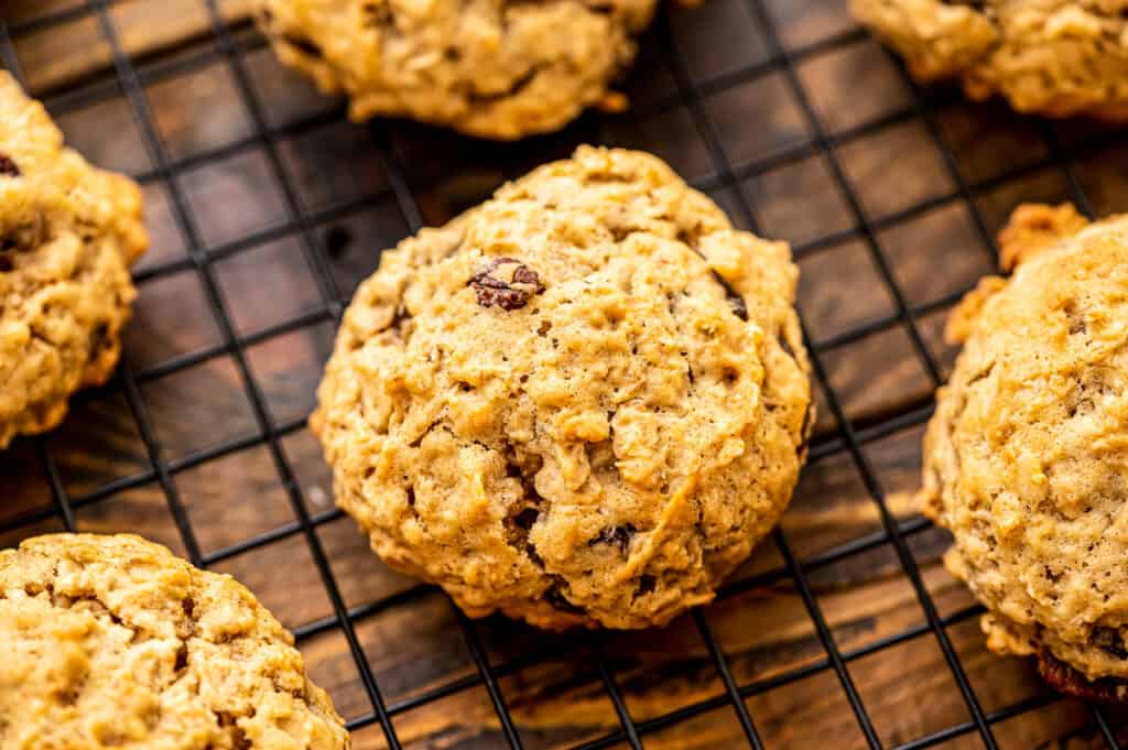 Baked oatmeal raisin cookies on wire cooling rack