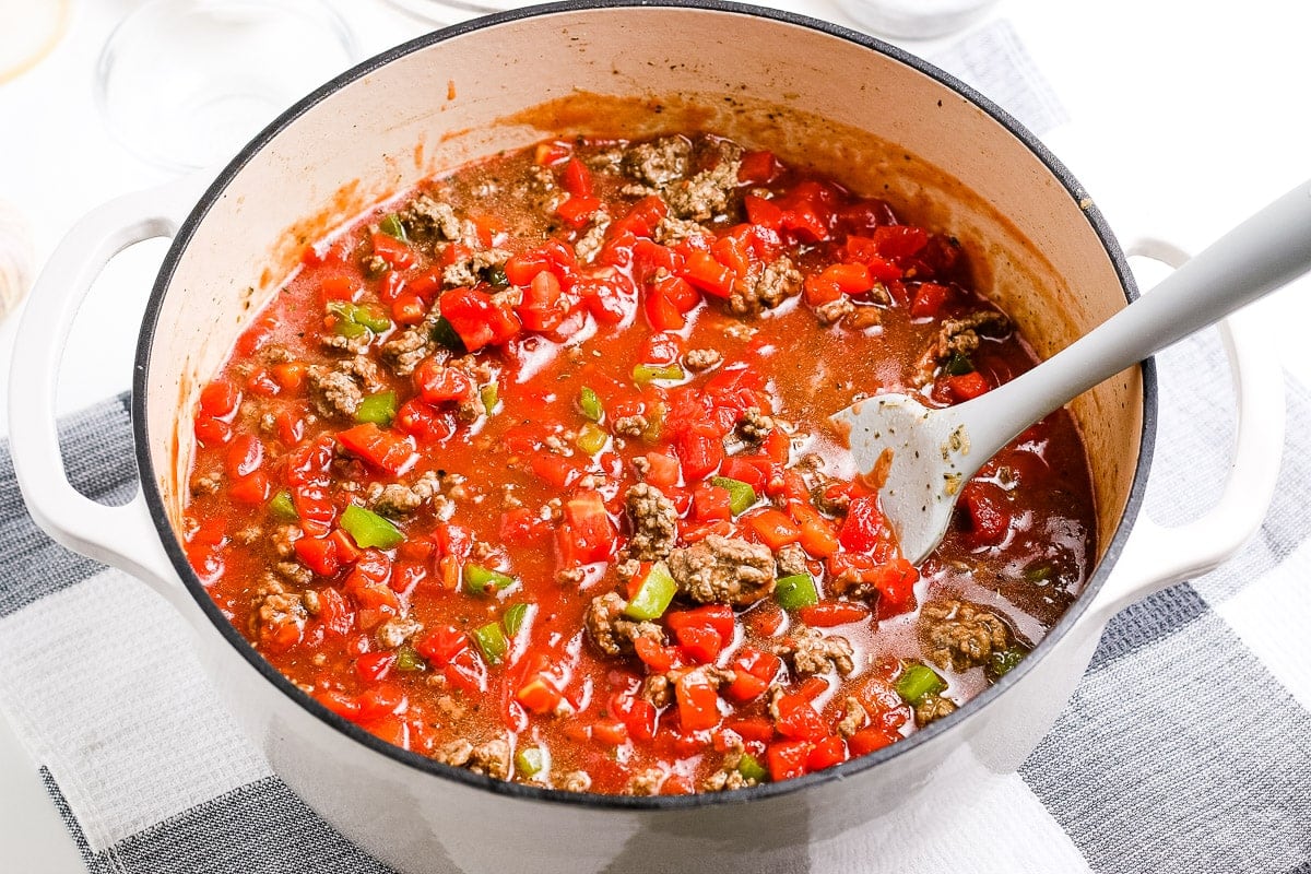 Stuffed Pepper Soup Recipe in Dutch Oven with spoon in it.