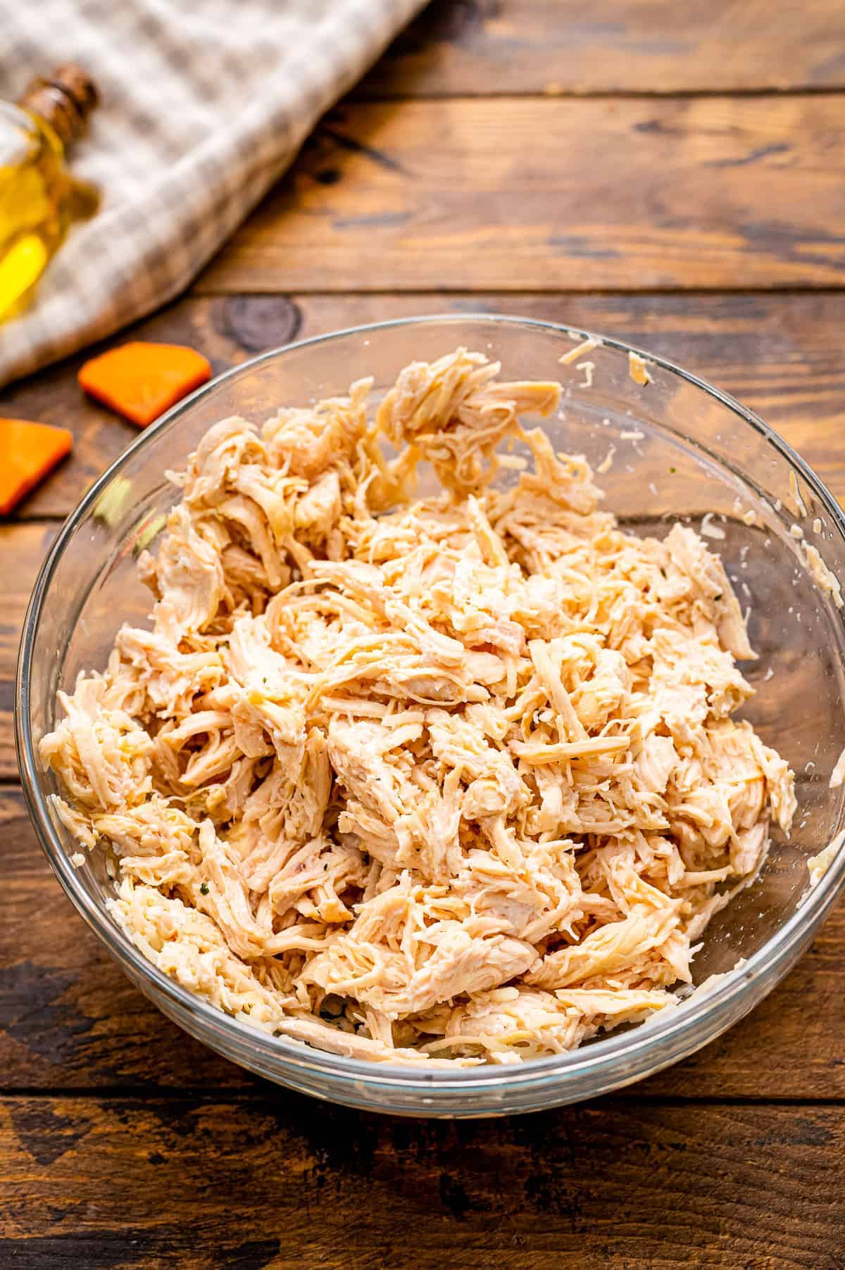 Shredded chicken breast in glass bowl