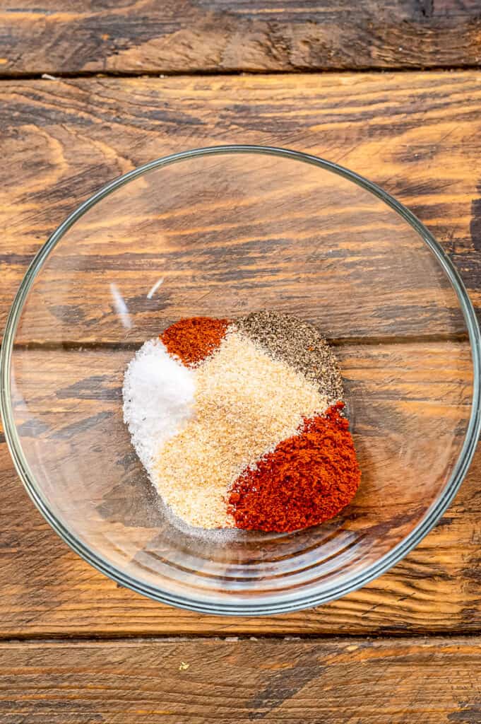 Glass bowl with ingredients to make chicken rub