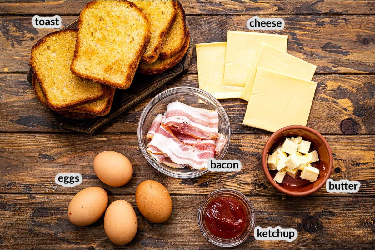 Fried Egg Sandwich Ingredients in bowls on wood background