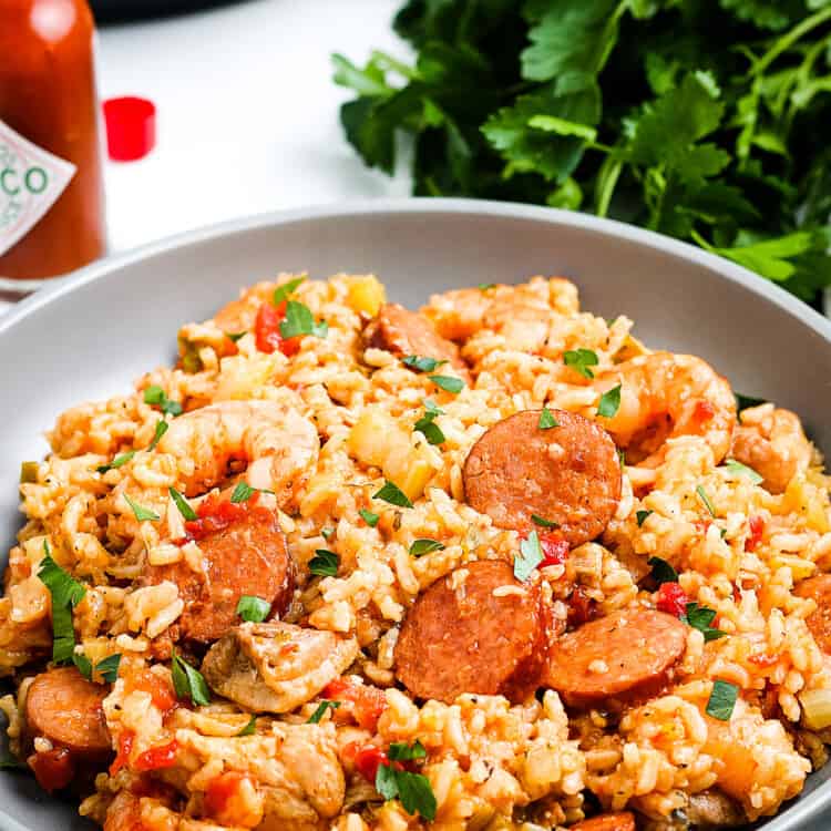 Plate of Instant Pot Jambalaya with parsley in background