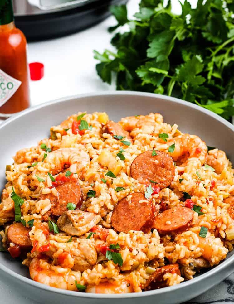 Plate of Instant Pot Jambalaya with parsley in background