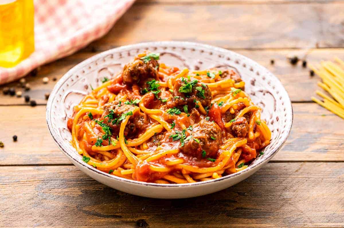 Spaghetti and Meatballs in a cream colored bowl