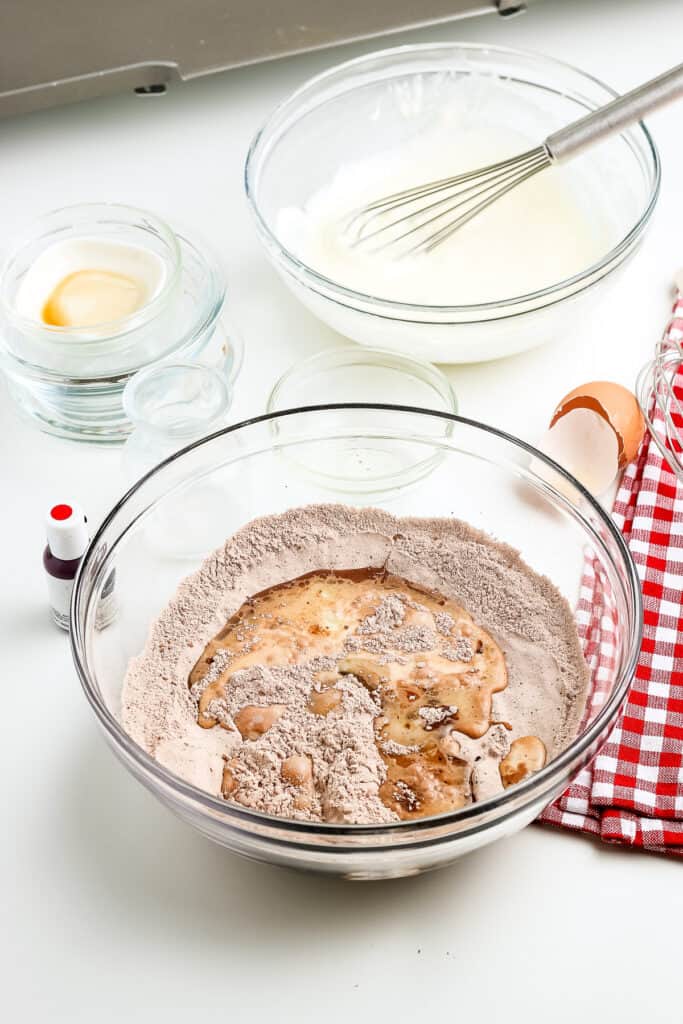 A glass bowl with dry ingredients for pancakes