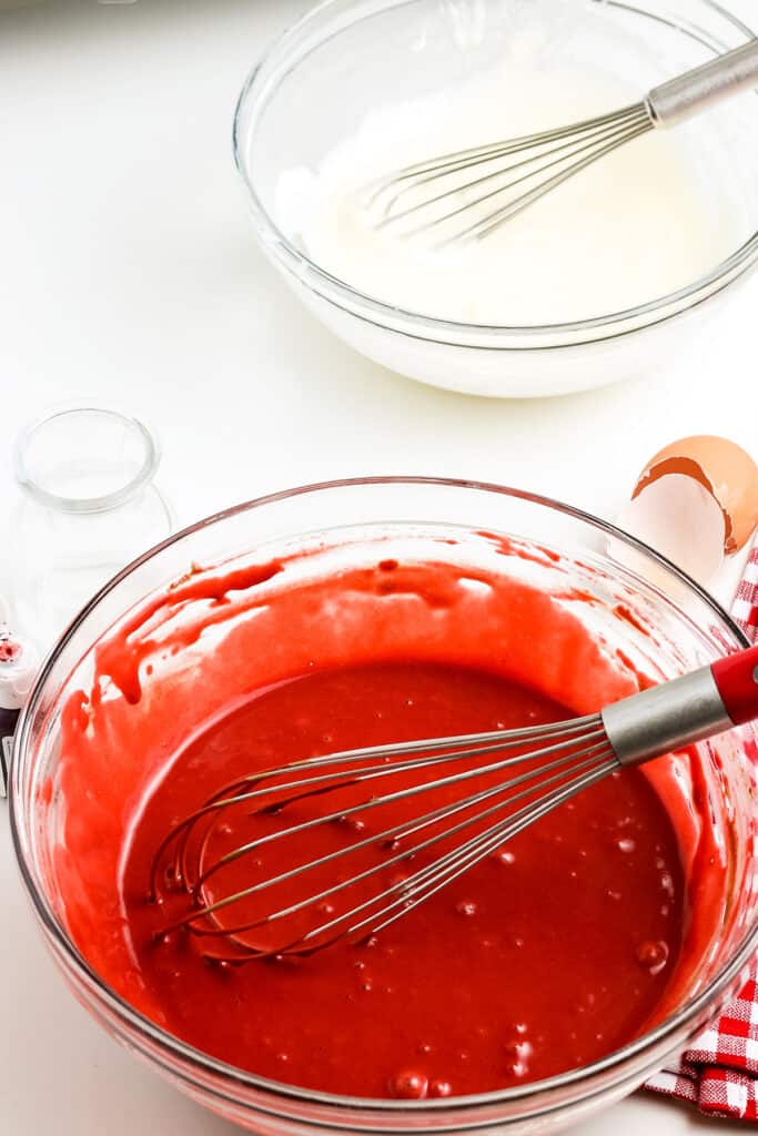 Glass bowl with mixed batter for red velvet pancakes