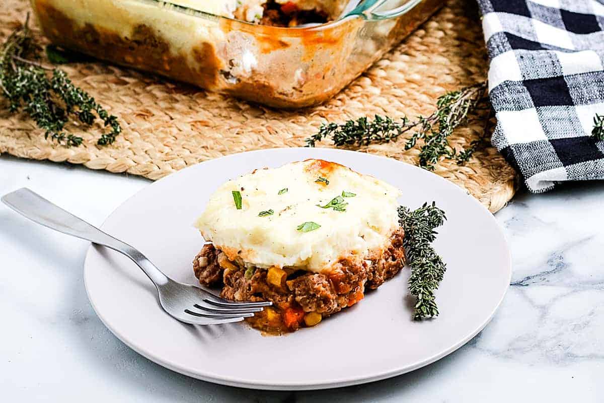 Shepherds Pie on a white plate with a fork