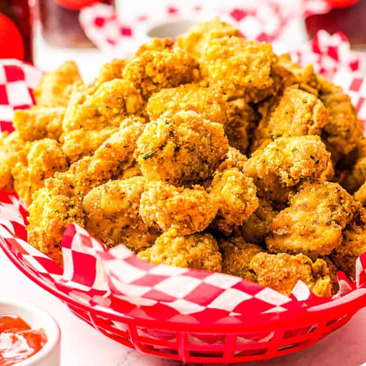 Air Fryer Chicken Nuggets in a basket with red and white paper napkin