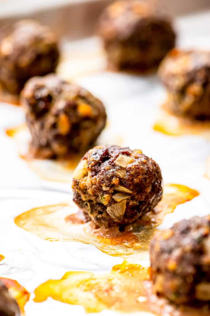 Baked meatballs on baking sheet