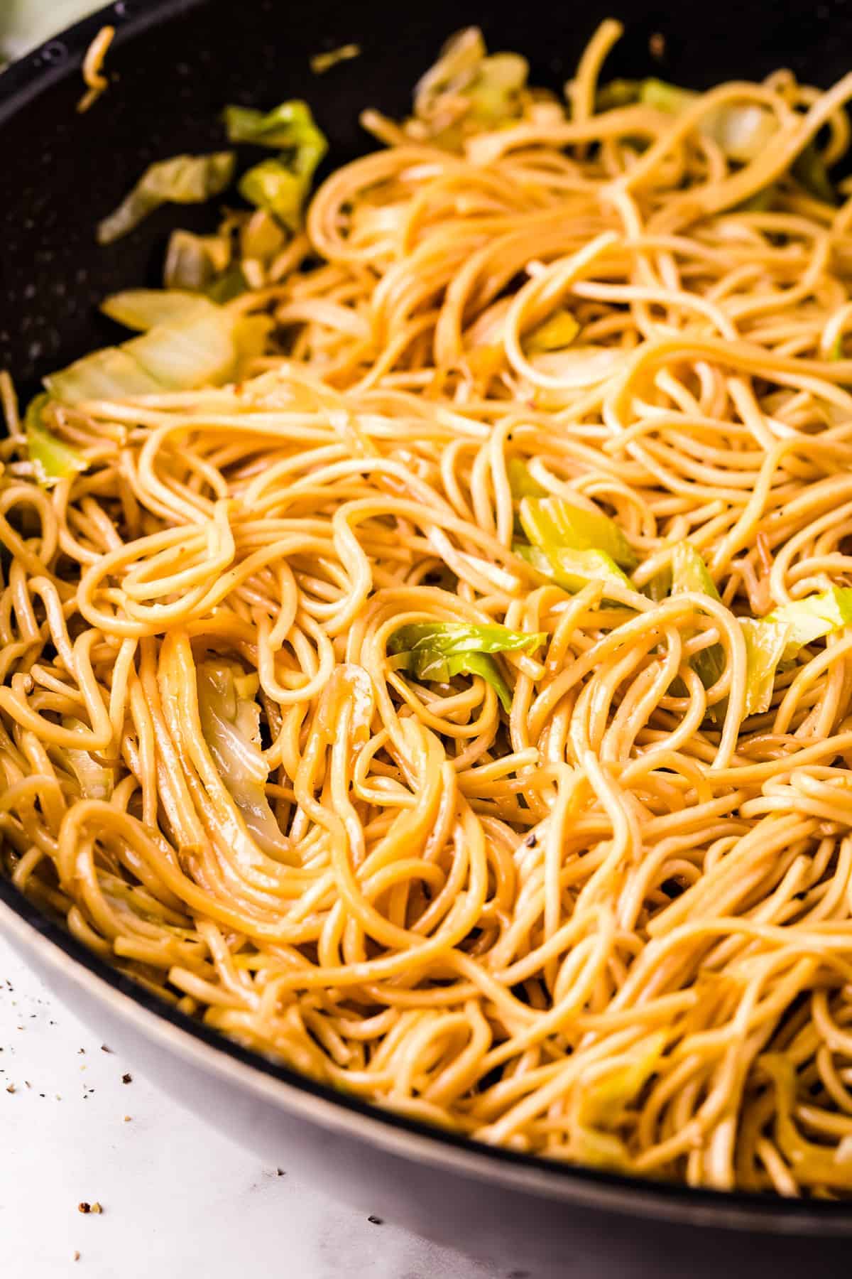 Skillet with chow mein in it