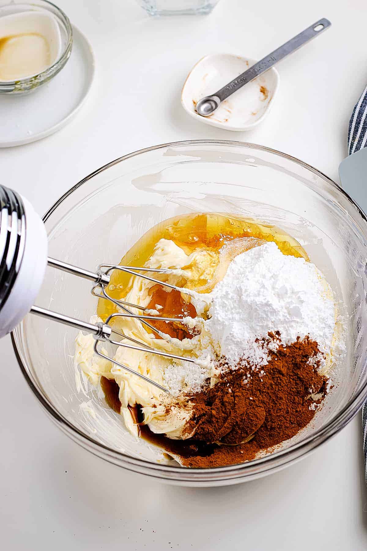 Glass bowl with ingredients to make Cinnamon Honey butter