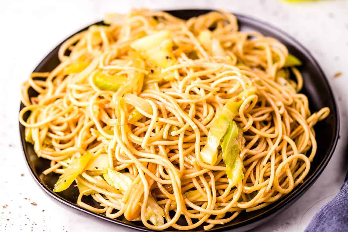 Black plate with chow mein on it