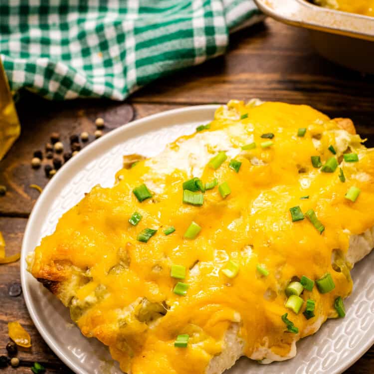 Creamy Chicken Enchiladas are on a white plate