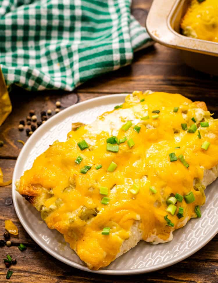 Creamy Chicken Enchiladas are on a white plate