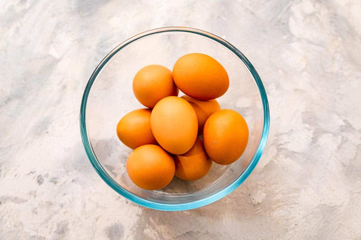 Overhead image of glass bowl with brown eggs in it