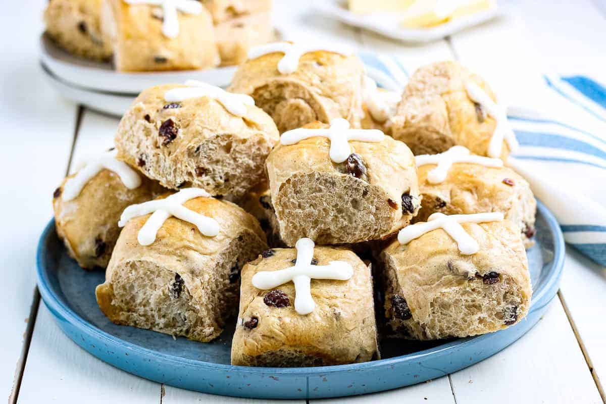 Blue plate with Hot Cross Buns stacked on it