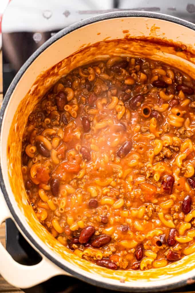 Overhead image of chili mac simmering in dutch oven