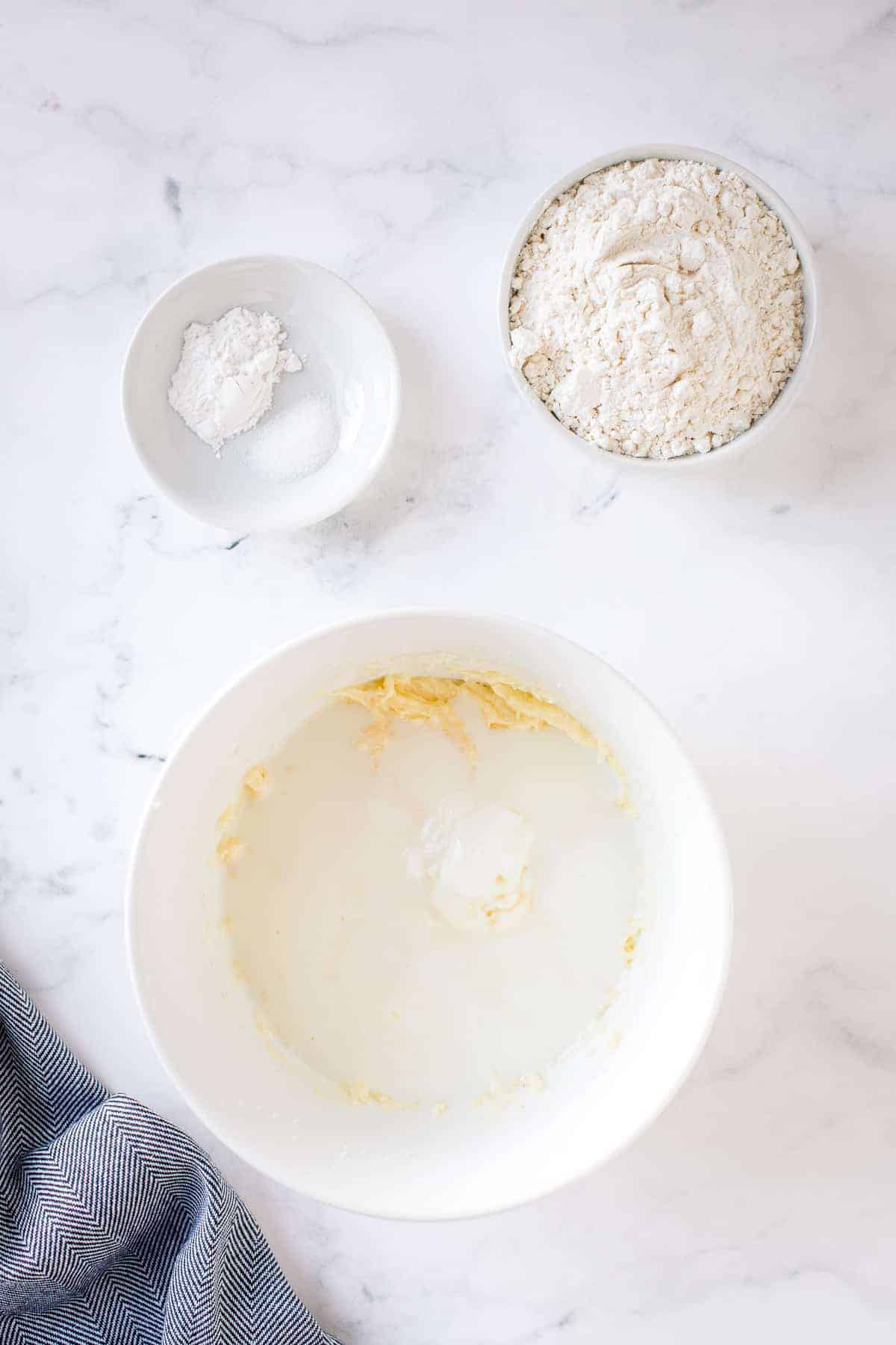 Creamed mixture in white bowl with yogurt on top