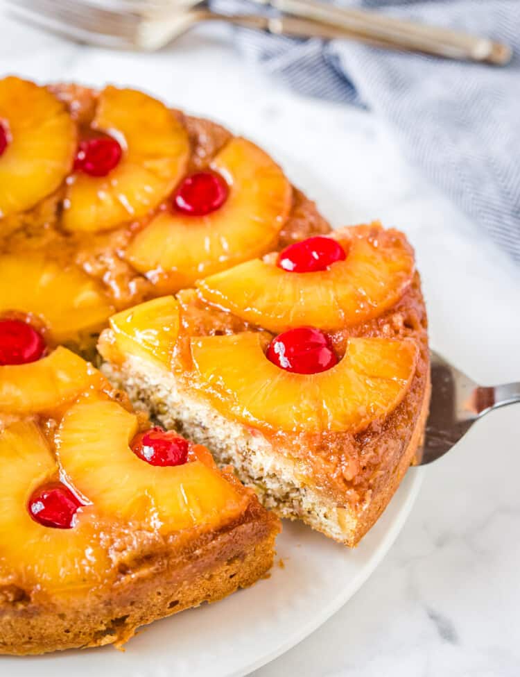Pineapple Upside Down Cake with a slice being removed