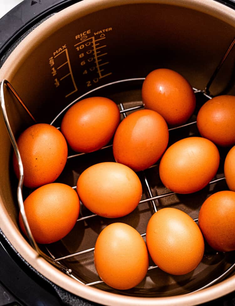 Instant Pot with eggs on a trivet inside.