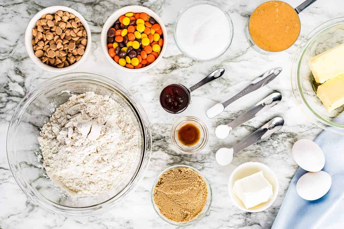 Reese's Pieces Cookies Ingredients in small bowls