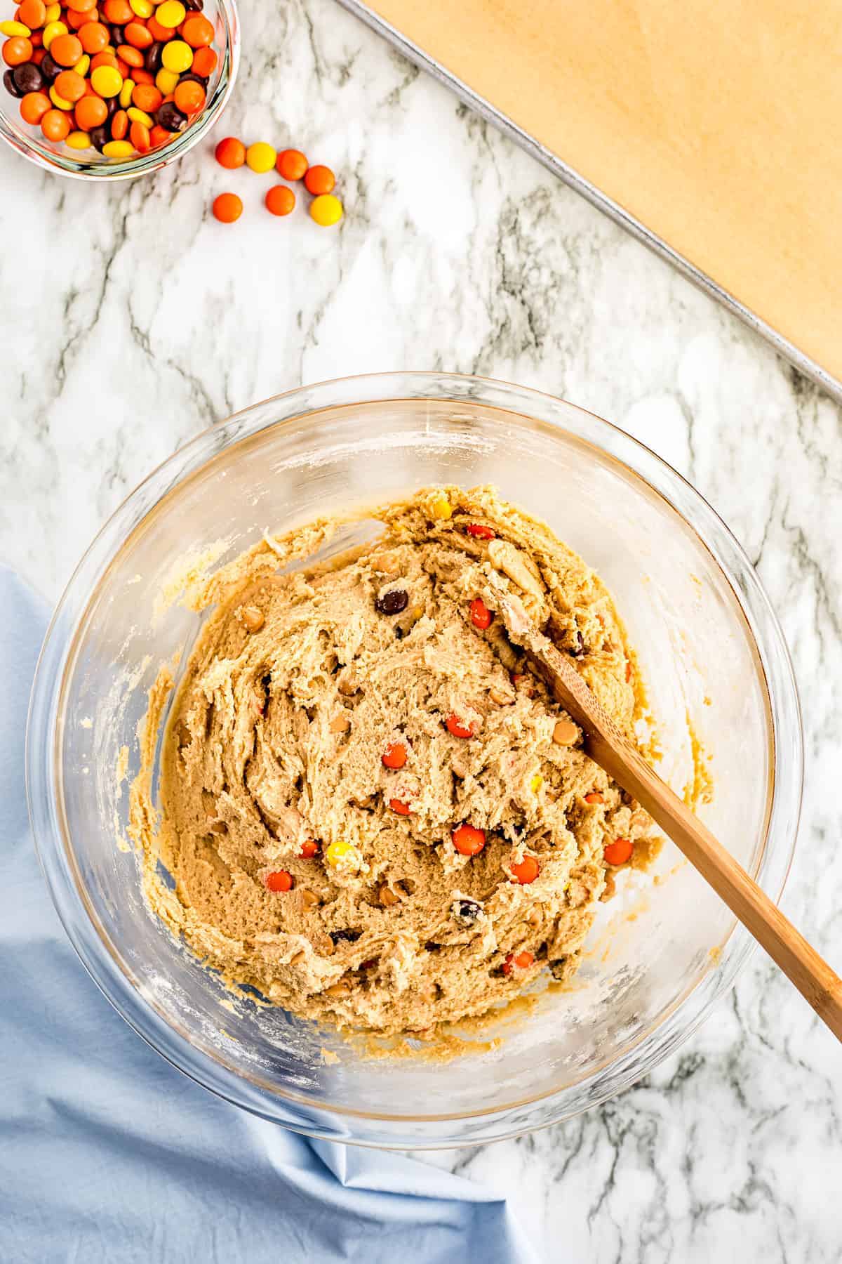 Peanut Butter Cookie dough with Reese's pieces in glass bowl
