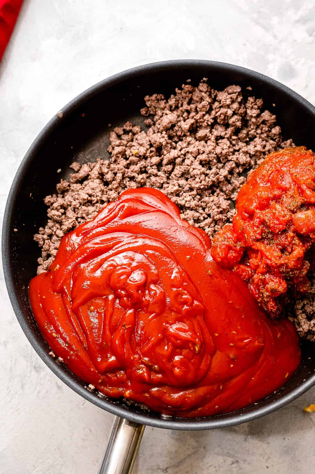 Making meat sauce in skillet for lasagna