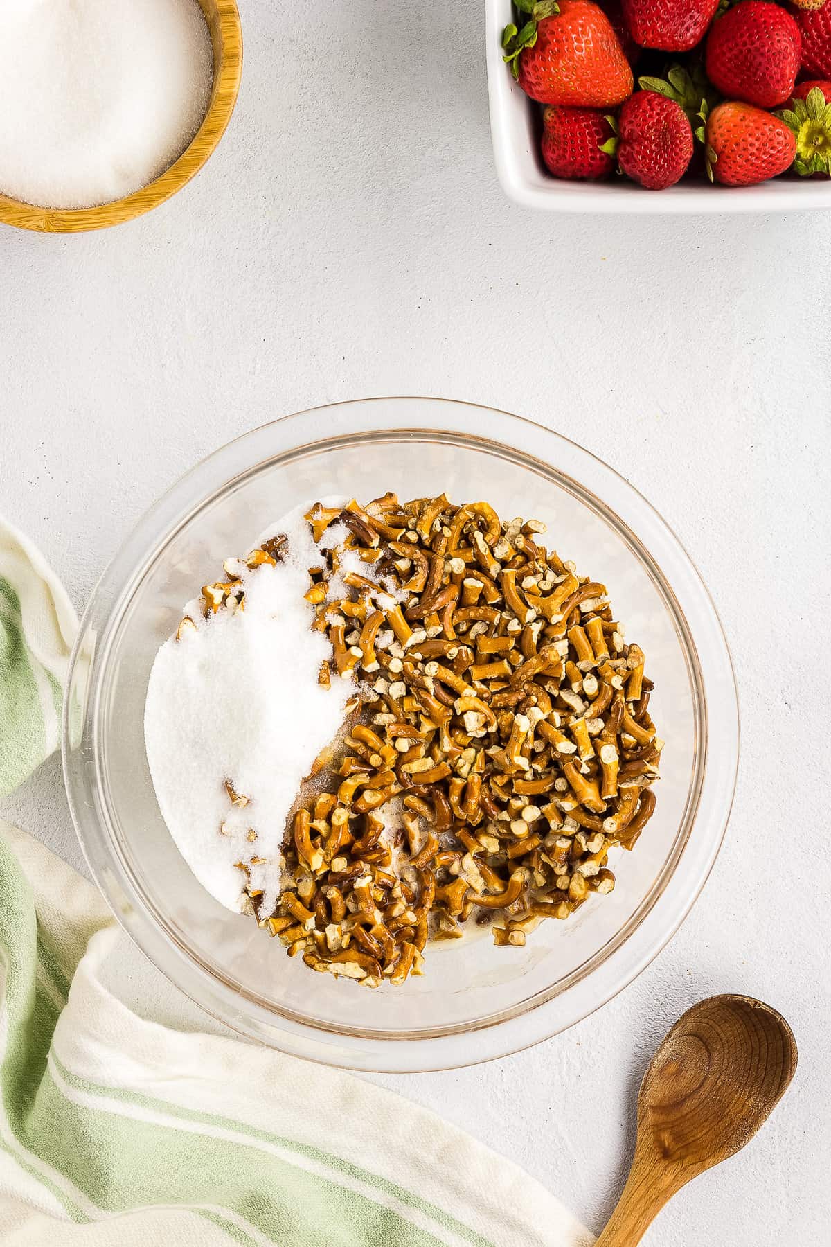 Glass bowl with crushed pretzels and sugar