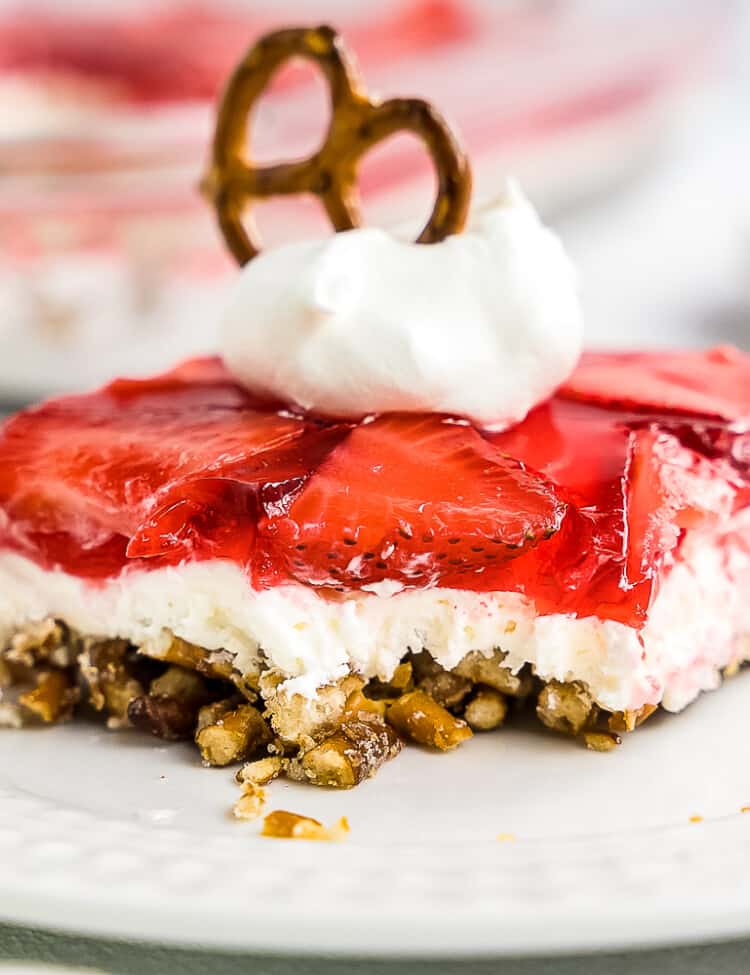 Slice of Strawberry Pretzel Salad on white plate