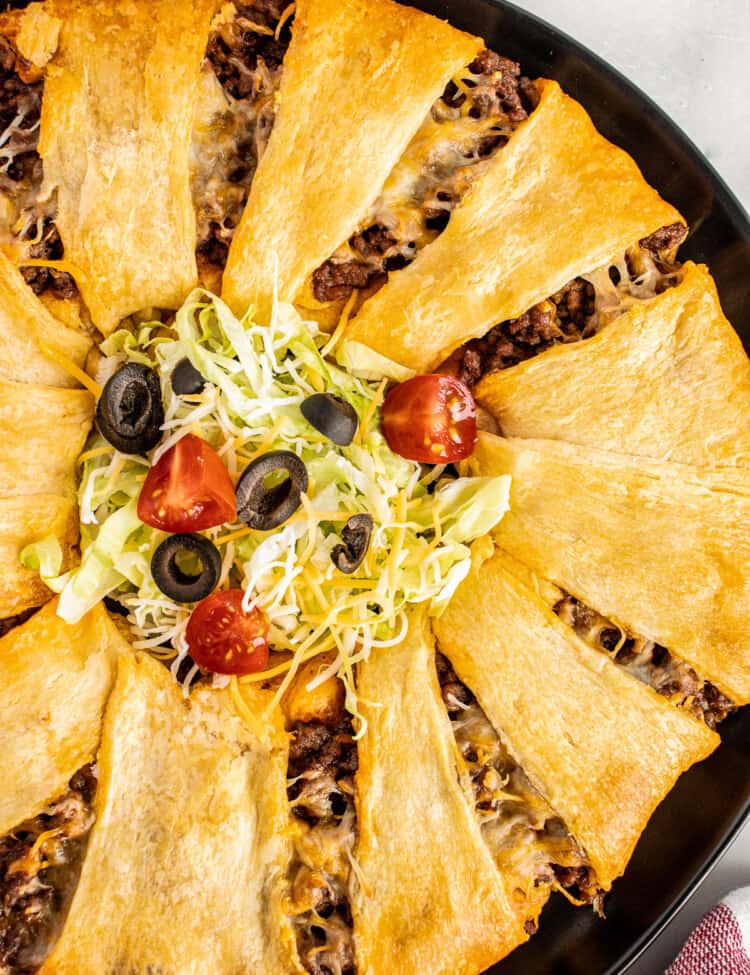 Taco Ring on dark plate with taco toppings in center