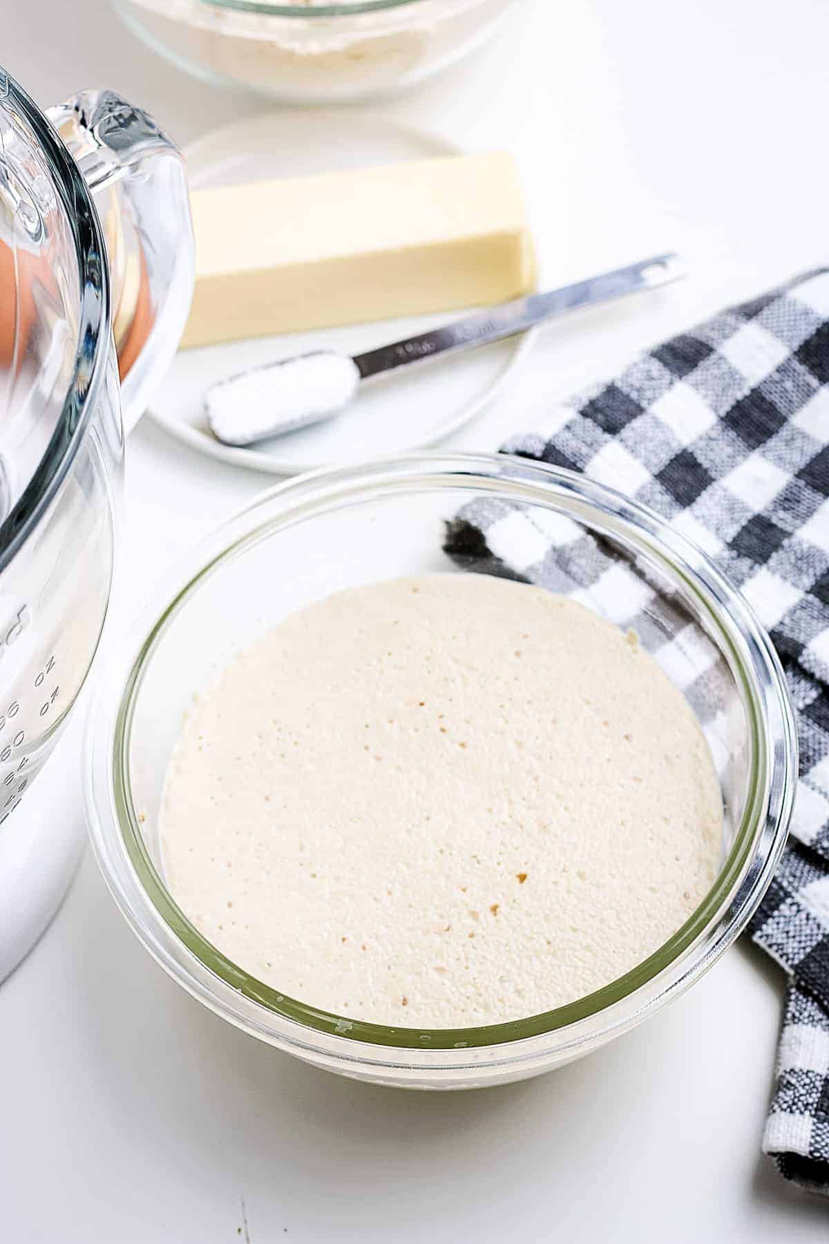 Proofed yeast in a glass bowl