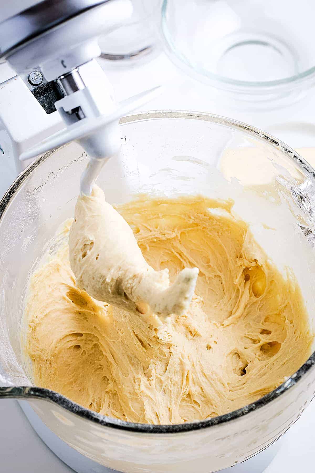 Dough mixed together by a stand mixer with hook