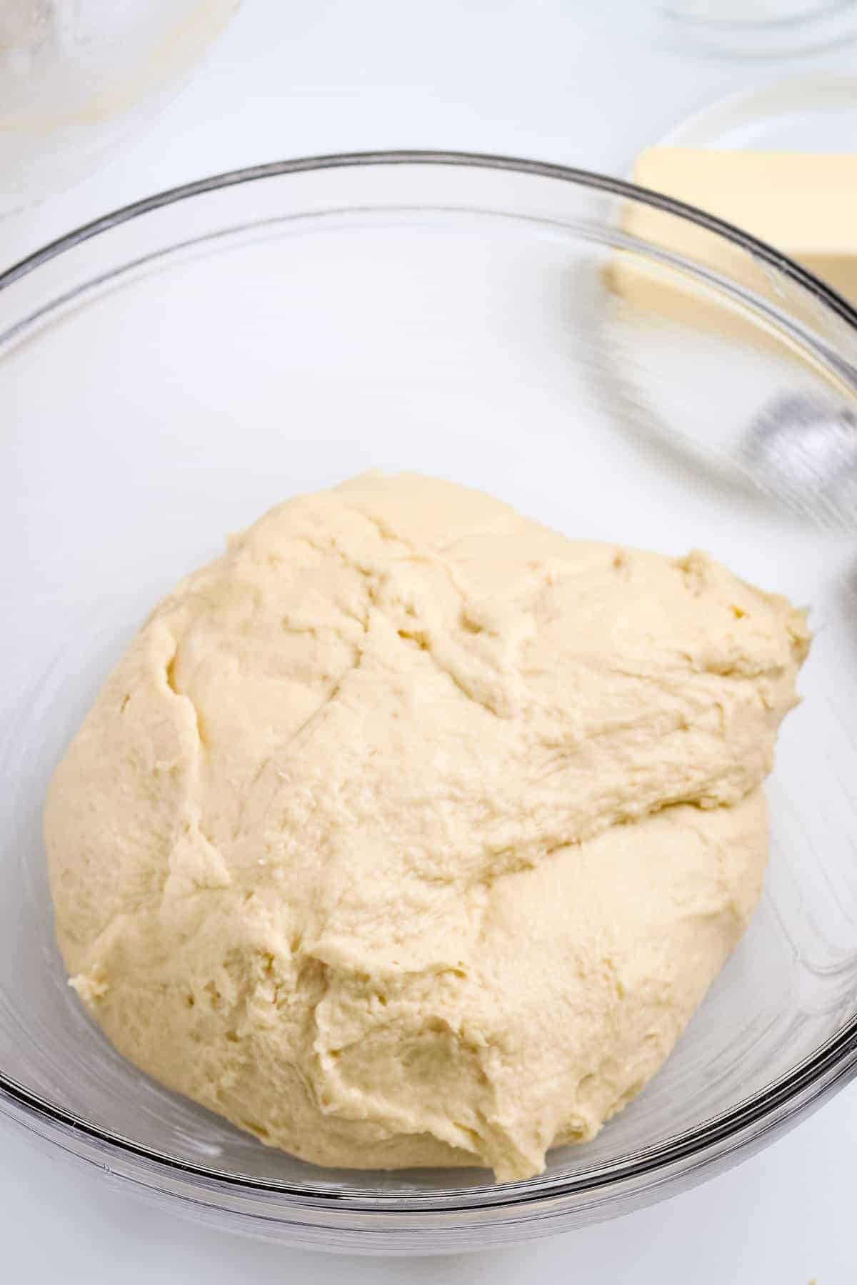 Dough in glass bowl before proofing