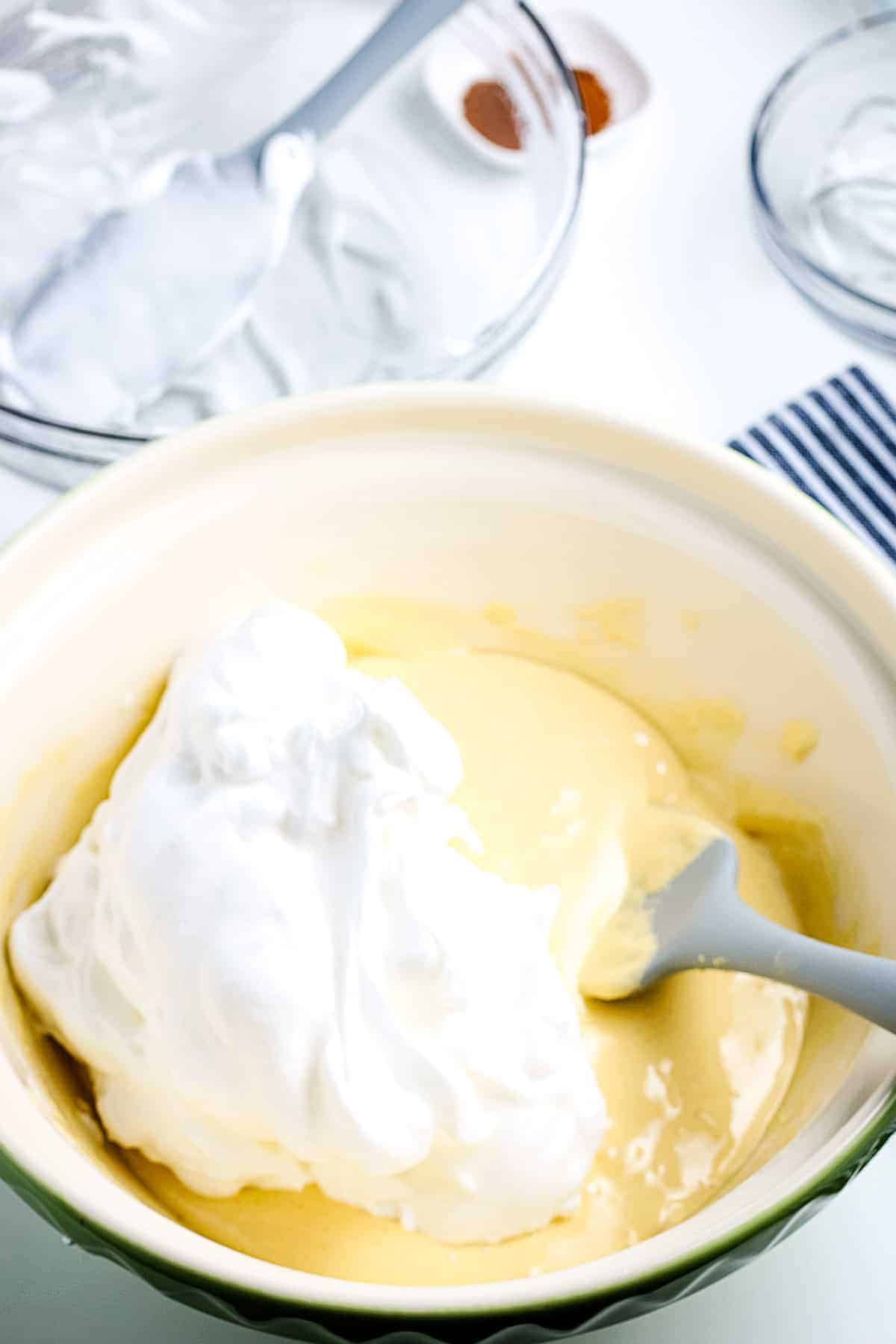 Folding whipped cream into cake batter