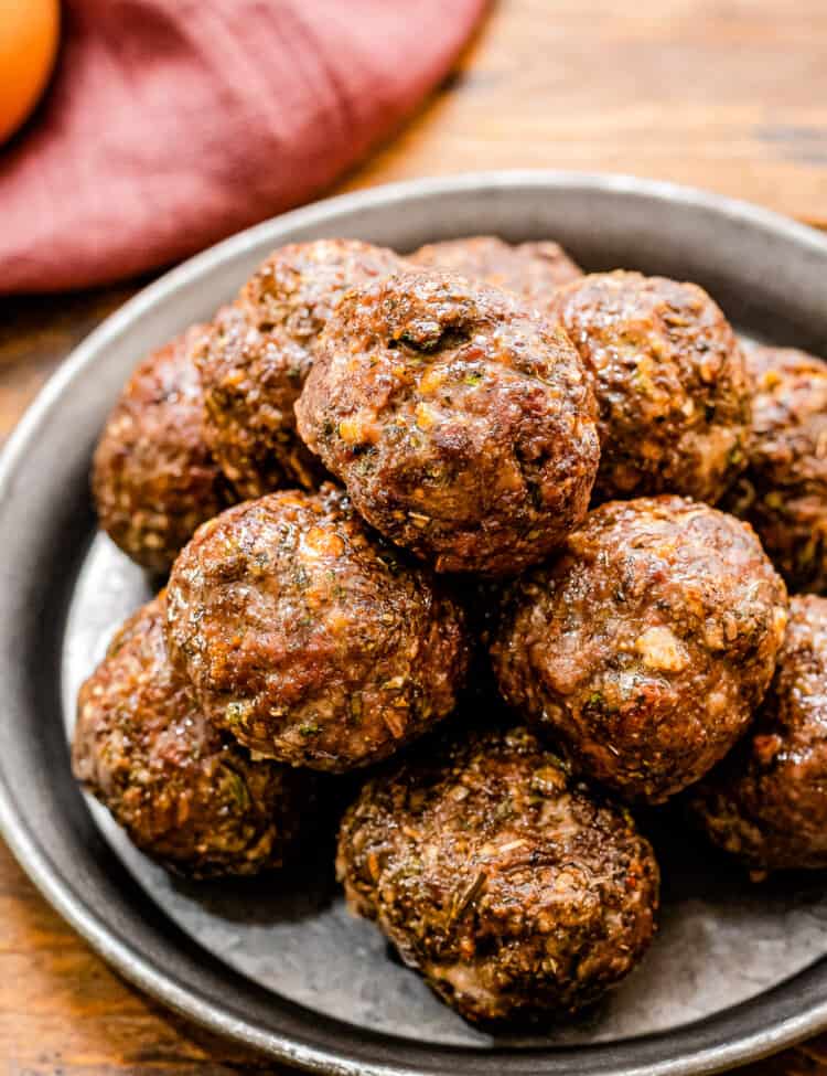 Plate with a stack of meatballs on it