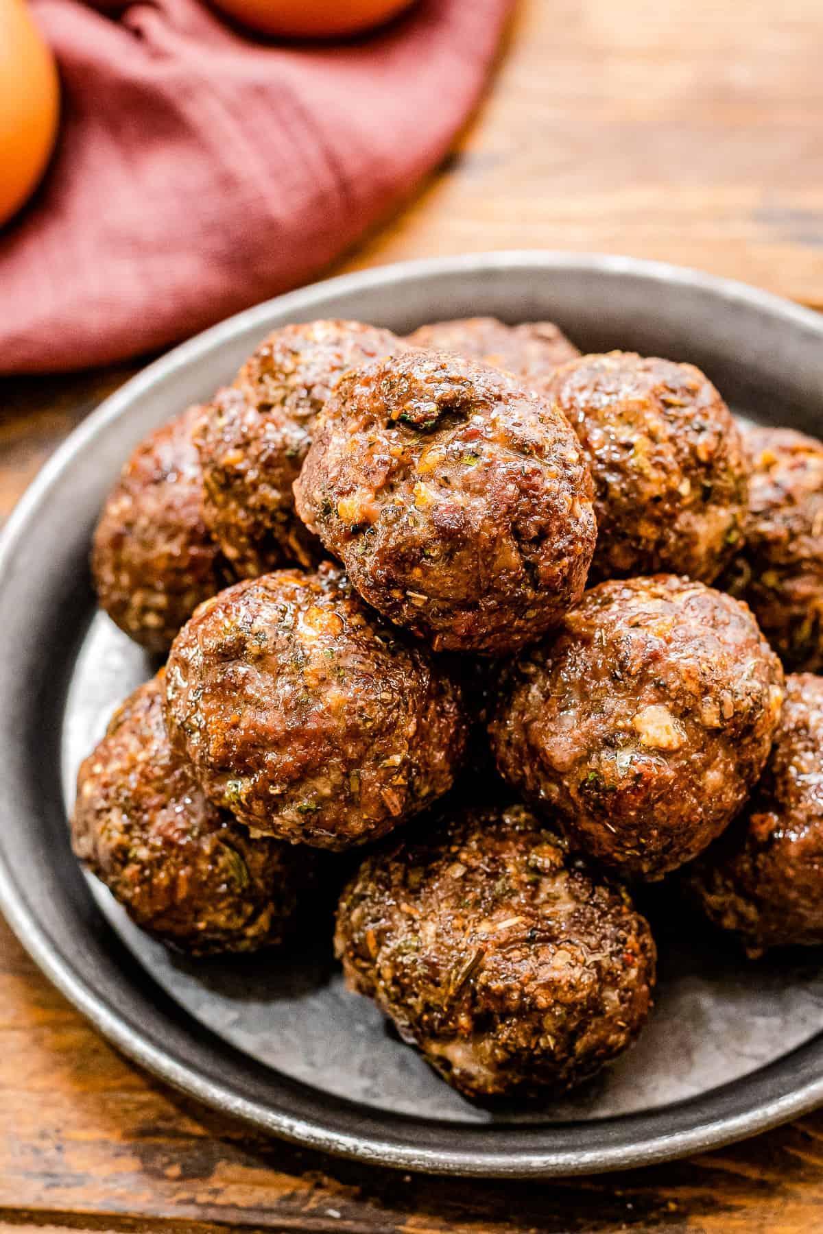 Plate with a stack of meatballs on it