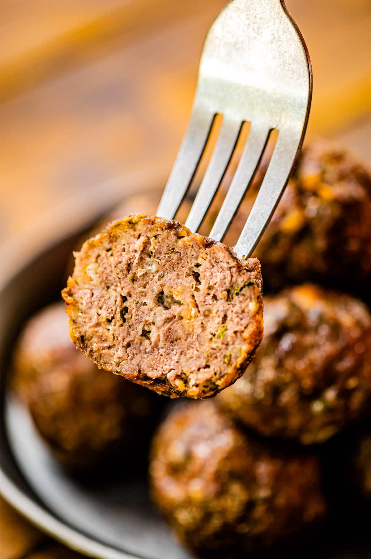 Meatball cut in half on a fork