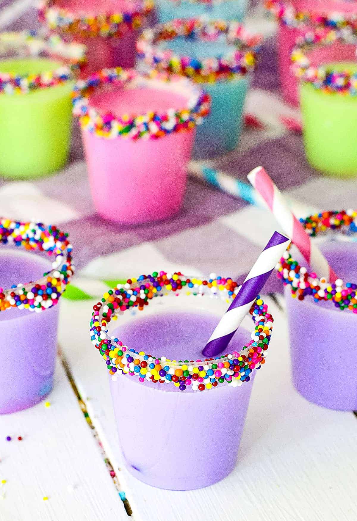 Birthday Cake Shots with mini straws in them