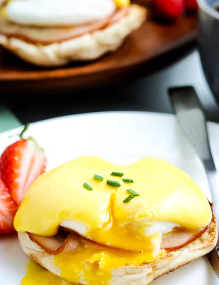 Eggs Benedict on white plate