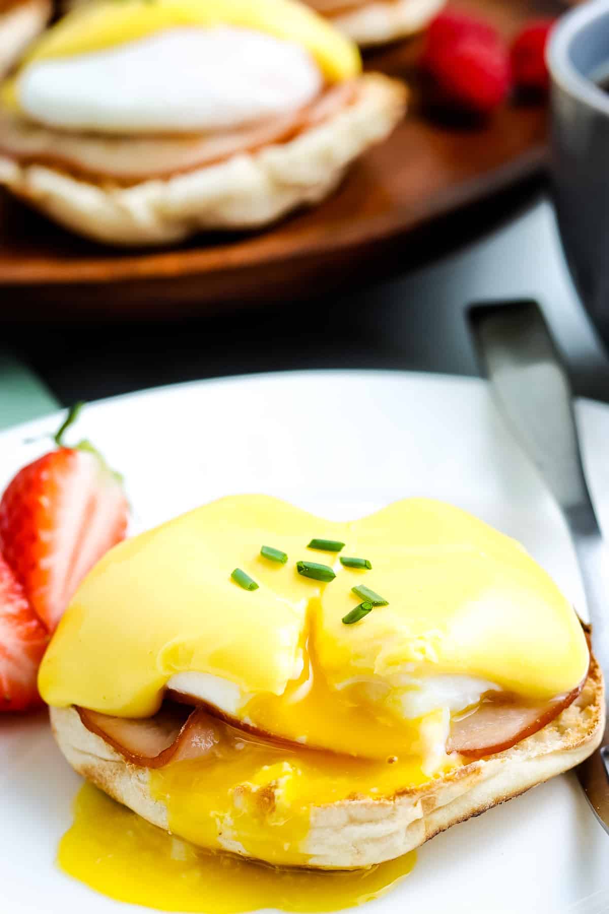 Eggs Benedict on white plate