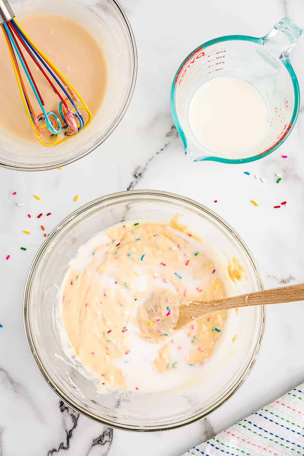 Milk in bowl with funfetti pancake batter