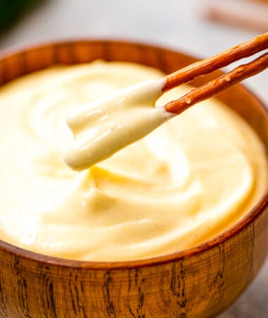 Two pretzels dipped in Honey Mustard dip