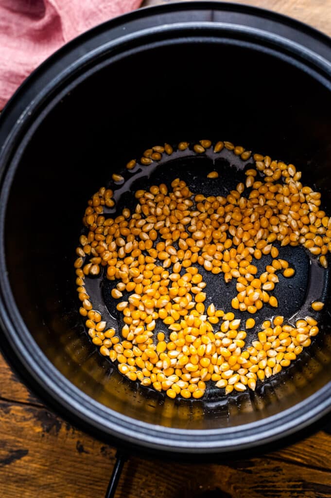 Instant Pot with popcorn kernels in oil